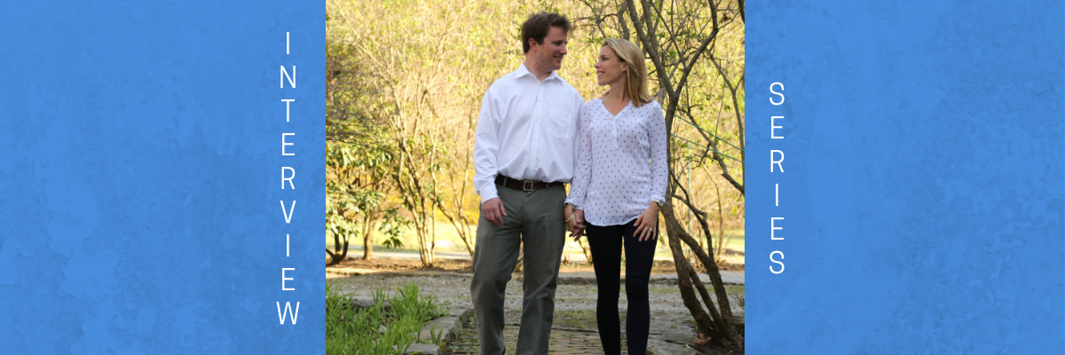 Allison Pataki and Dave Levy walking in a tree lined park holding hands.