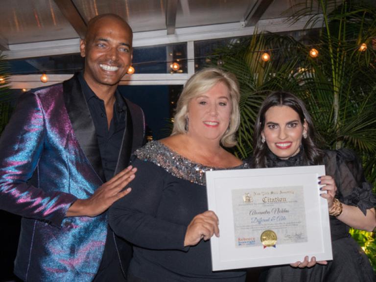 Billy Blanks Jr., Rebecca Seawright, and Alexandra Nicklas, who is holding up a reward she recieved