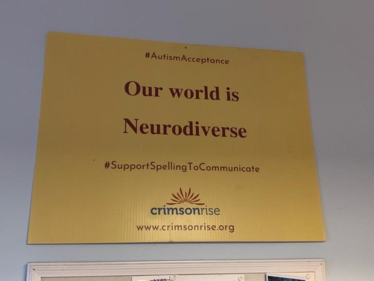 A sign that reads "Our world is neurodiverse"