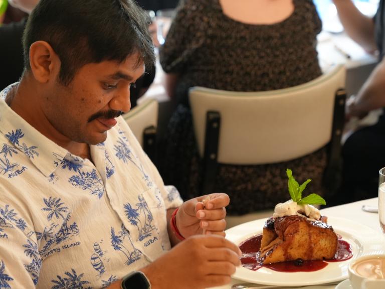 A guest looking at their food