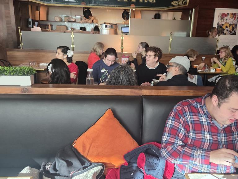 Guest Talking at Brunch