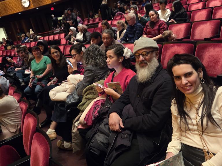 Guests sitting in the theater seats