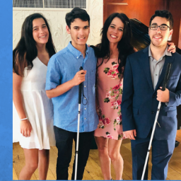 Imge of Kristin Smedley & her three children, Karissa, Michael, & Mitchell. The boys are diagnosed with Leber’s Congenital Amaurosis, which makes the boys blind. They are accompanied by white canes. 
