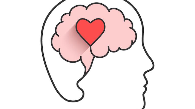 An outline of a brain with a heart in it