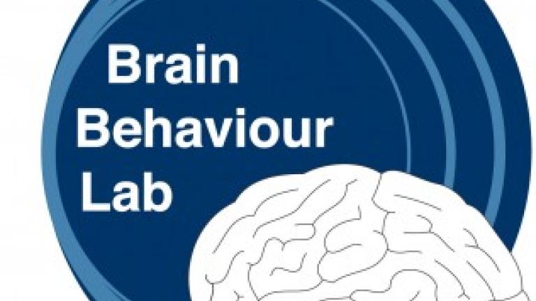 Image saying, "Brain Behavior Lab" on a blue circular background with a picture of a white brain.